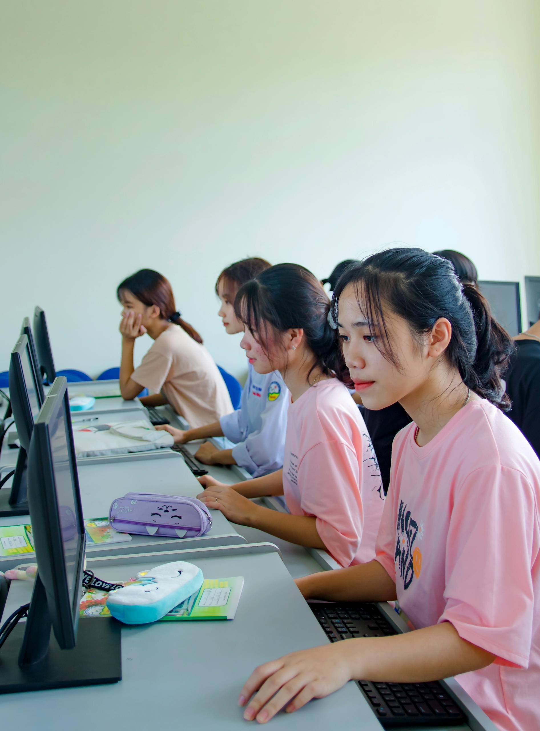 girls in a classroom in front of computers